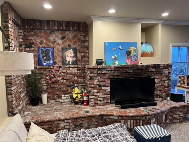 Reading Nook featuring Brick Fireplace with Extended Hearth Seating.