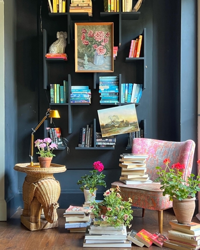 Reading Nook Moody Maximalist Design with Black Geometric Shelves
