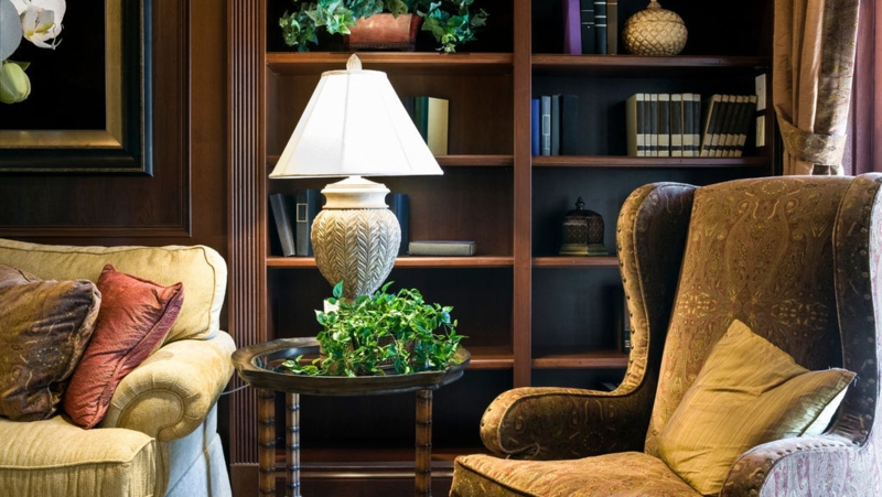 Reading Nook with Patterned Wingback Chair and Textured Lamp Base