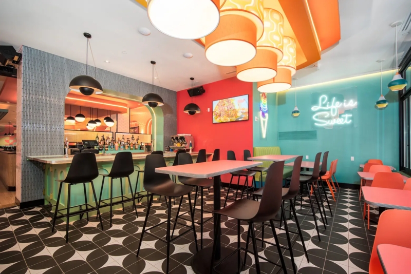 Retro 70s Restaurant Decor: Geometric Petal Floor & Color Blocking