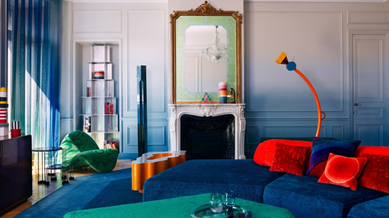 Royal Blue Sectional Sofa in Vibrant Living Room with Ombre Walls