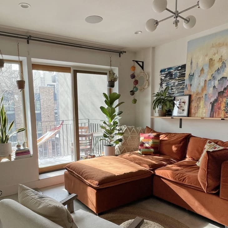 Rust Colored Sectional Sofa in Sun-Drenched Living Room