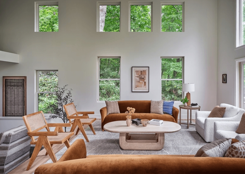 Rust Velvet Sofa and Cane Accent Chairs in Airy Living Room