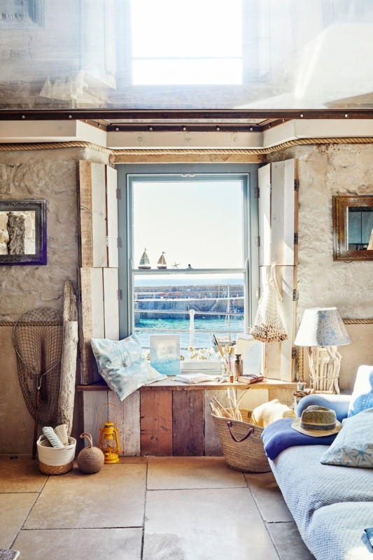 Rustic Coastal Window Nook: Exposed Stone Wall & Harbor View