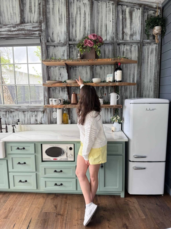 Rustic Cottage Kitchen with Distressed Wood Walls and Sage Cabinets