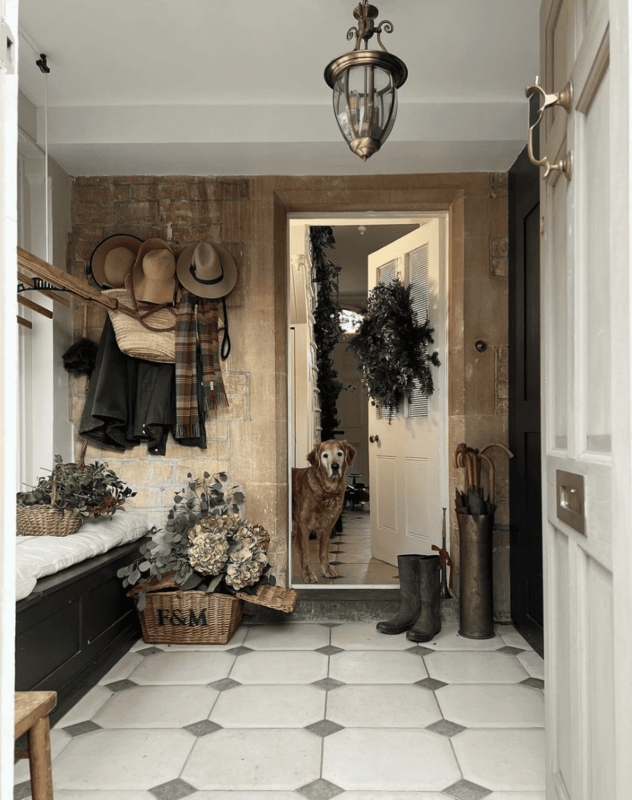 Rustic English Cottage Mudroom with Stone Walls & Octagonal Tile Floor