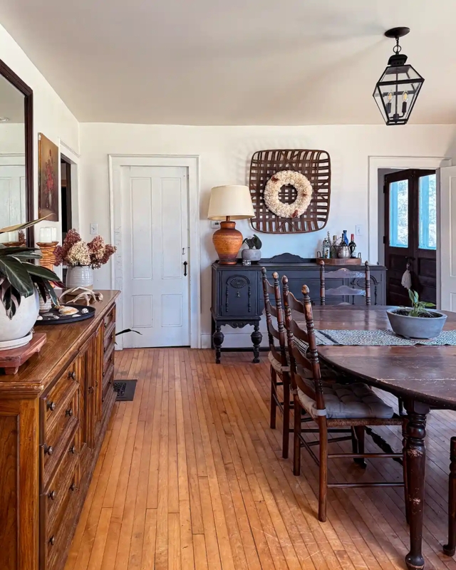 Rustic Farmhouse Dining Room featuring a navy blue buffet.