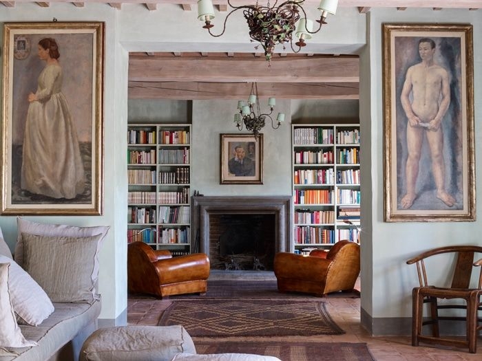 Rustic Italian Library: Built-in Bookcases & Cognac Leather Chairs