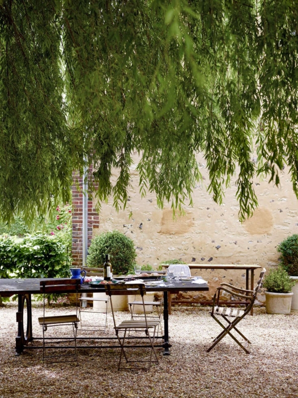 Rustic Outdoor Dining Table on Gravel Surface