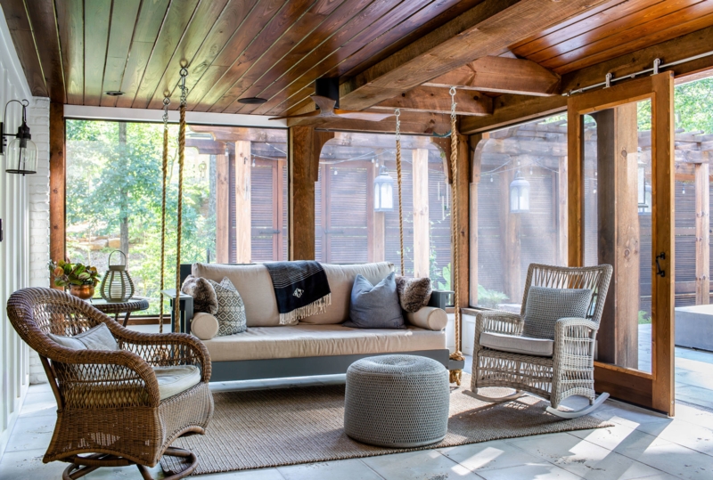 Rustic Porch with Hanging Daybed Swing & Natural Wood Ceiling.