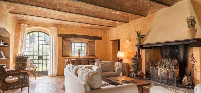 Rustic Tuscan Lounge: Vaulted Brick Ceiling & Hooded Fireplace