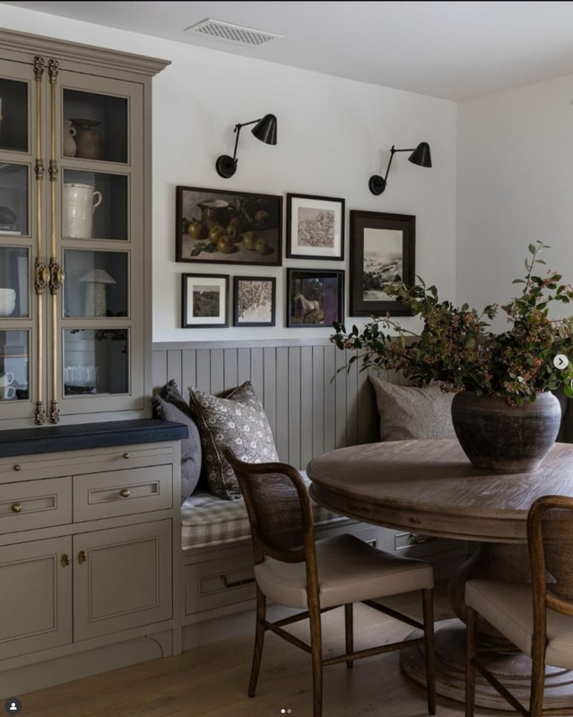 Sage Green Dining Nook with Cabinetry and Cane Back Chairs