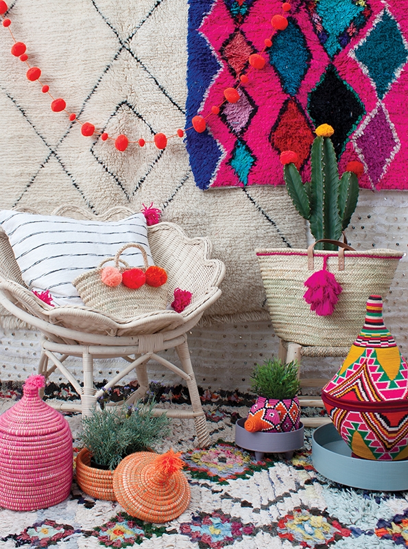 Scalloped Rattan Chair: Pom Pom Garland & Geometric Rug Wall Hangings