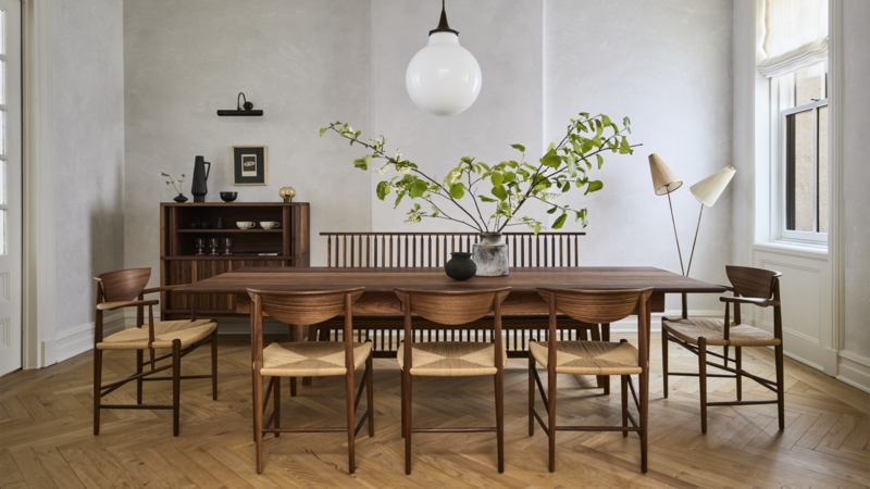 Scandinavian Dining Room with herringbone floor and woven seat chairs.