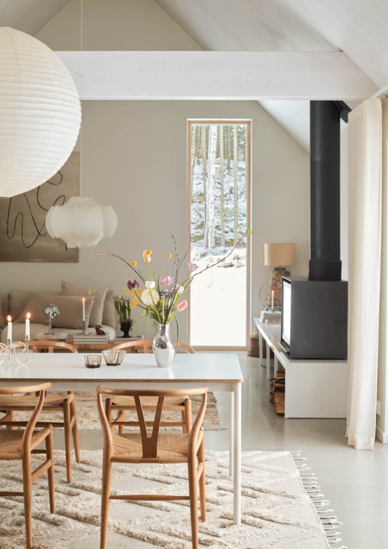 Scandinavian Dining Room with Wishbone Chairs and Paper Lantern Pendant.