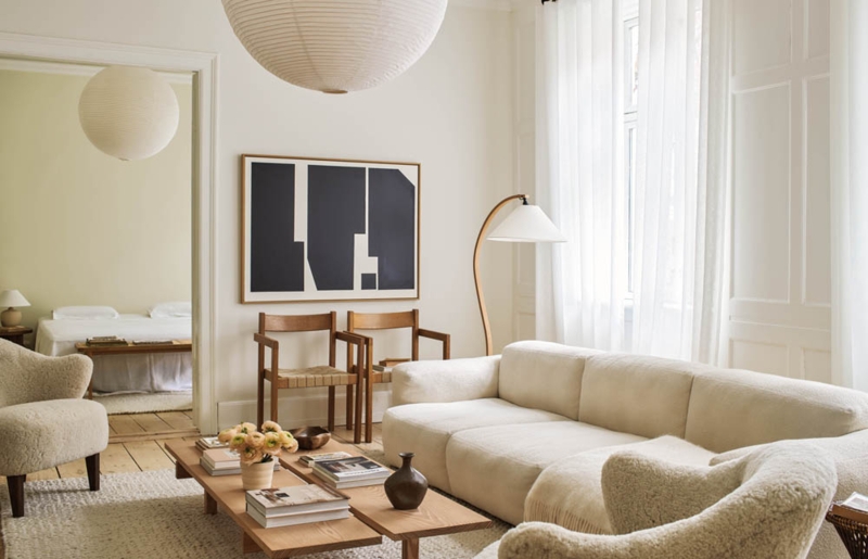 Scandinavian Living Room Layout: Sheepskin Chairs & Paper Lantern.