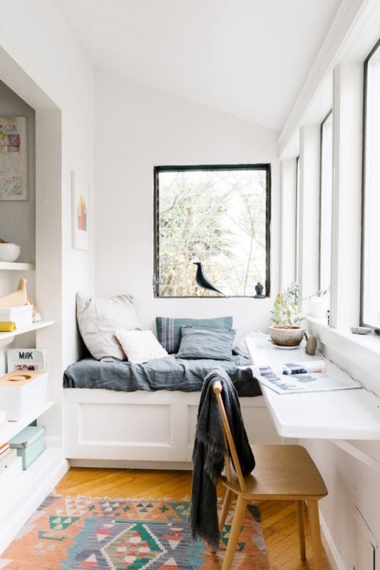 Scandinavian Nook Layout with floating wall-mounted desk and rug.