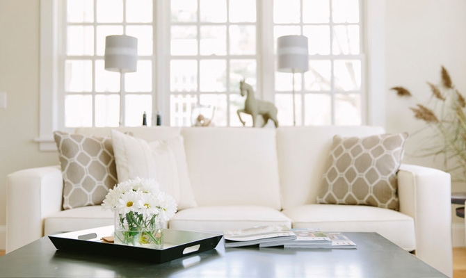 Serene Neutral Living Room with Geometric Lattice Pillows