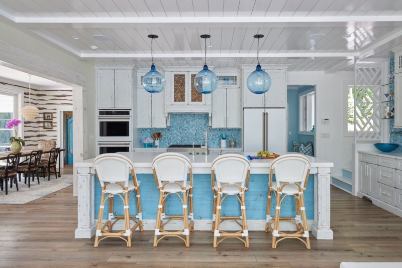 Shiplap Kitchen Island with Blue Glass Pendants and Woven Stools
