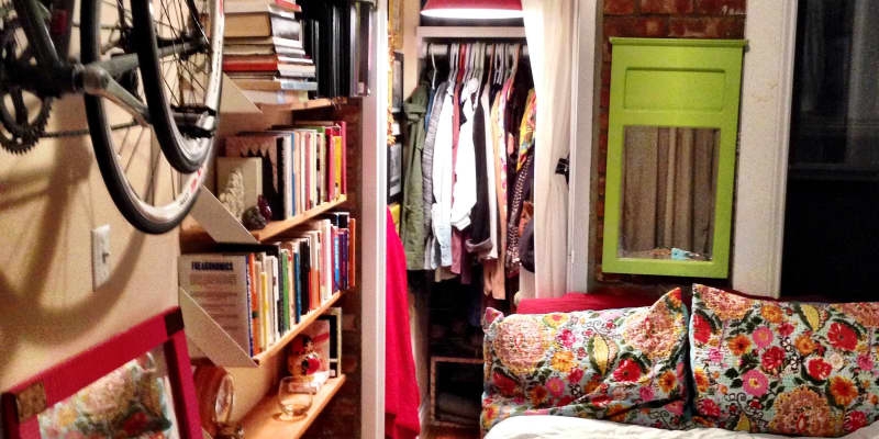 Small Bedroom with Dense Bookshelves, Exposed Brick and Eclectic Decor