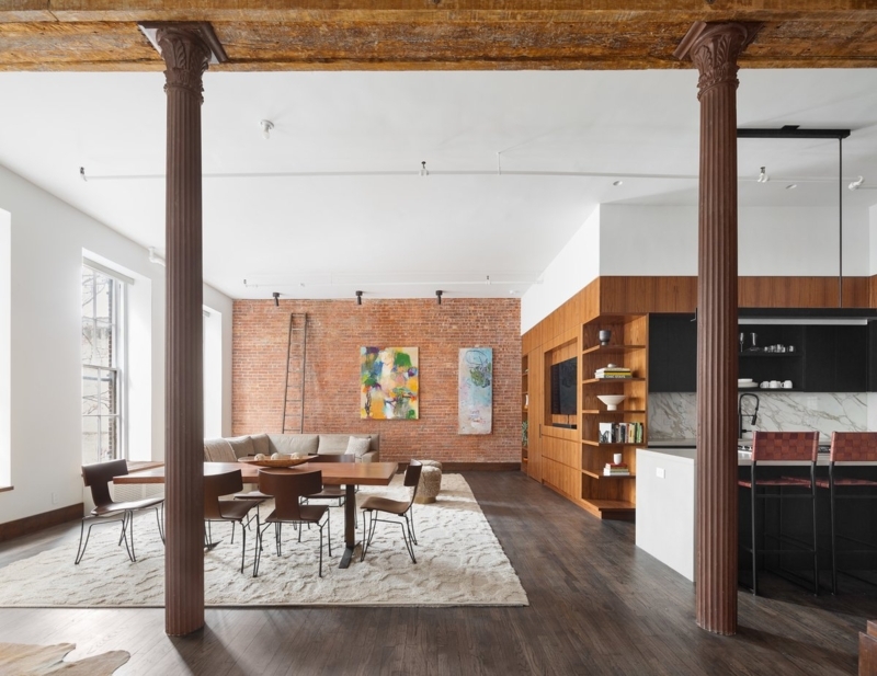 Spacious Industrial Loft Fluted Cast Iron Columns Walnut Built Ins