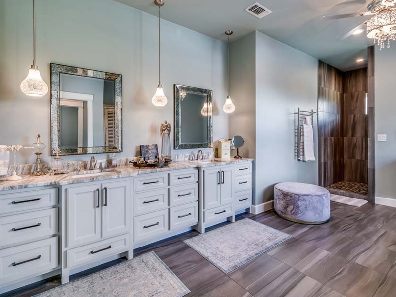 Spacious Master Bathroom with Soft Blue Walls and Wood-Look Tile