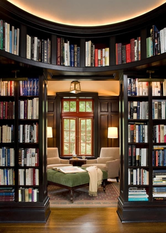 Stately Home Library: Arched Bookshelf Design & Green Tufted Ottoman