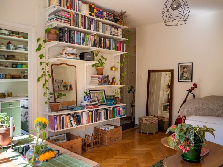 Studio Apartment with Herringbone Floor and Scandi White Wall Shelving