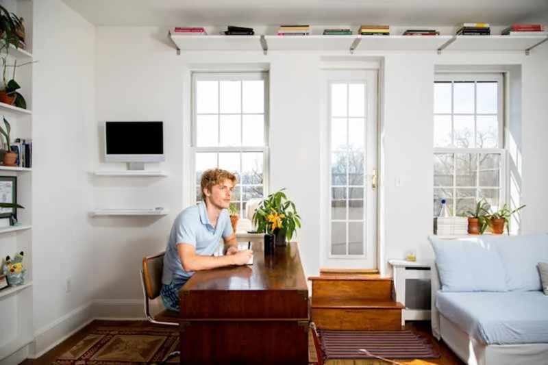 Studio Apartment with Trunk Desk, High Shelving and Bright White Decor