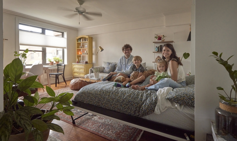 Studio Apartment with Yellow Hutch, Floral Bedding and Eclectic Charm
