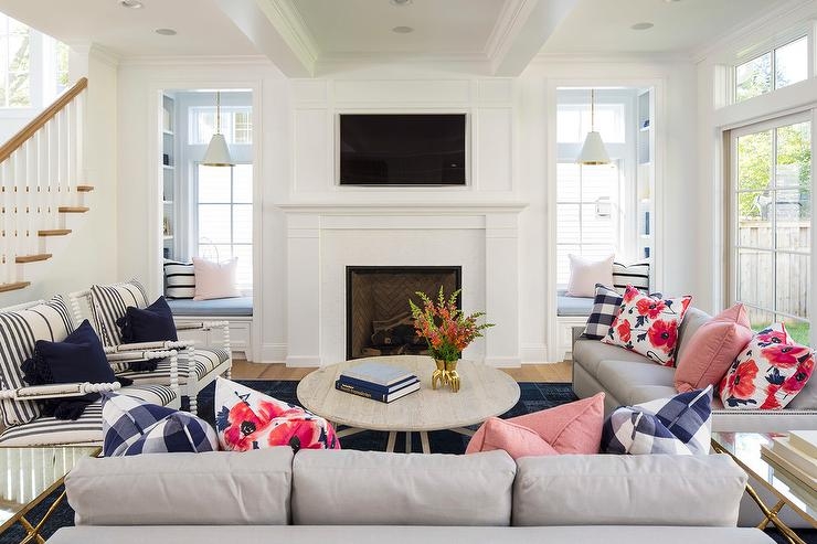Symmetrical Living Room: Built-in Window Seat Alcoves & Fireplace.