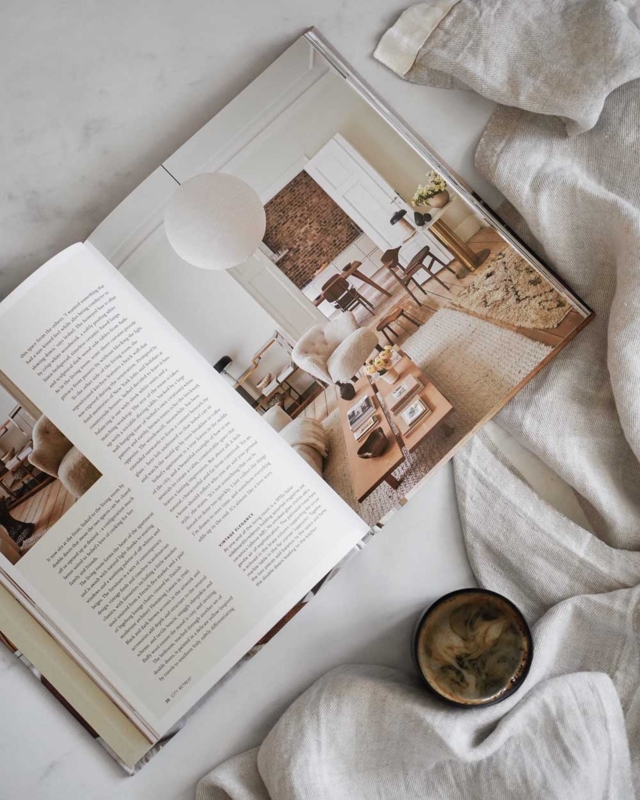 Tactile Flat Lay Styling: Minimalist Interiors Book & Marbled Coffee.