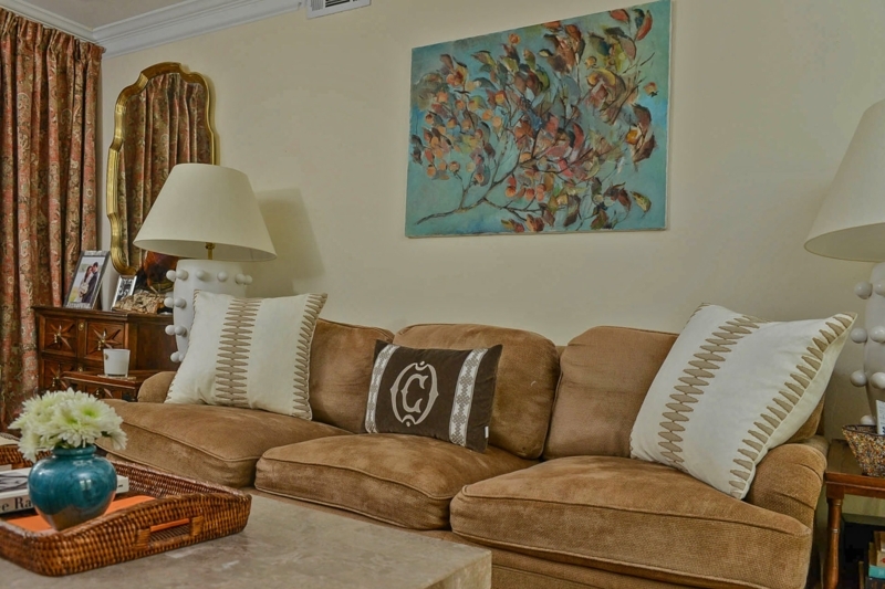Tan Upholstered Sofa Styling with Teal Botanical Art & Textured Lamps