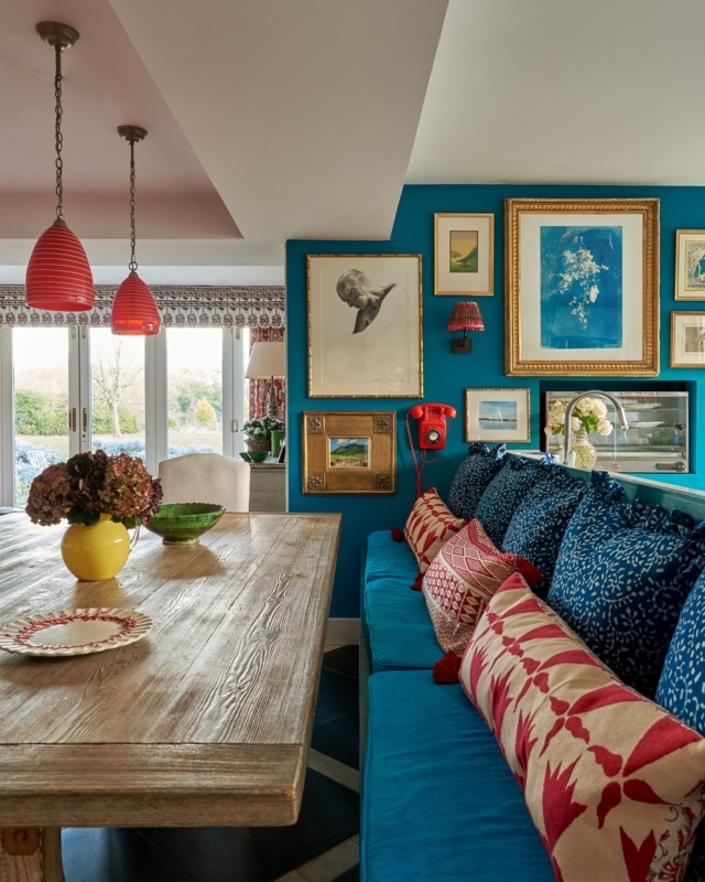 Teal Gallery Wall Dining Room with Red Pendant Lights