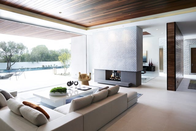 Textured Fireplace Facade in Modern Living Room with Wood Slat Ceiling
