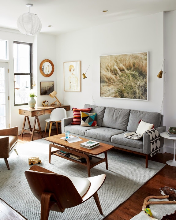 Tiered Wood Coffee Table in Mid-Century Modern Living Room with Desk