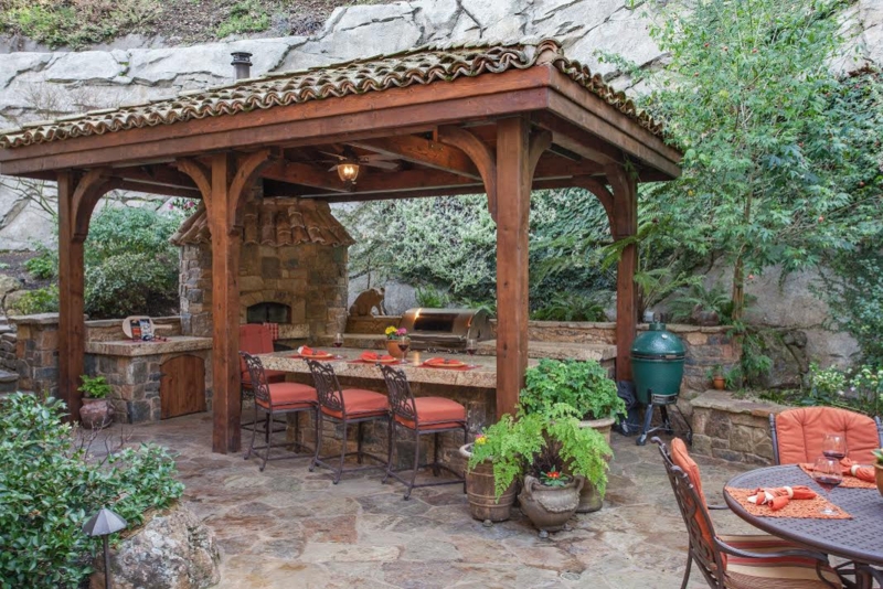 Timber Frame Pavilion Outdoor Kitchen with Stone Pizza Oven and Tile Roof