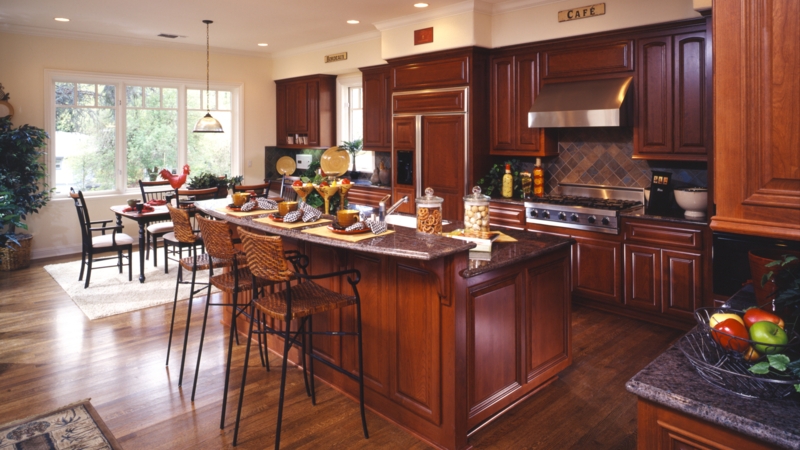 Traditional Cherry Wood Kitchen with Woven Island Seating and Granite