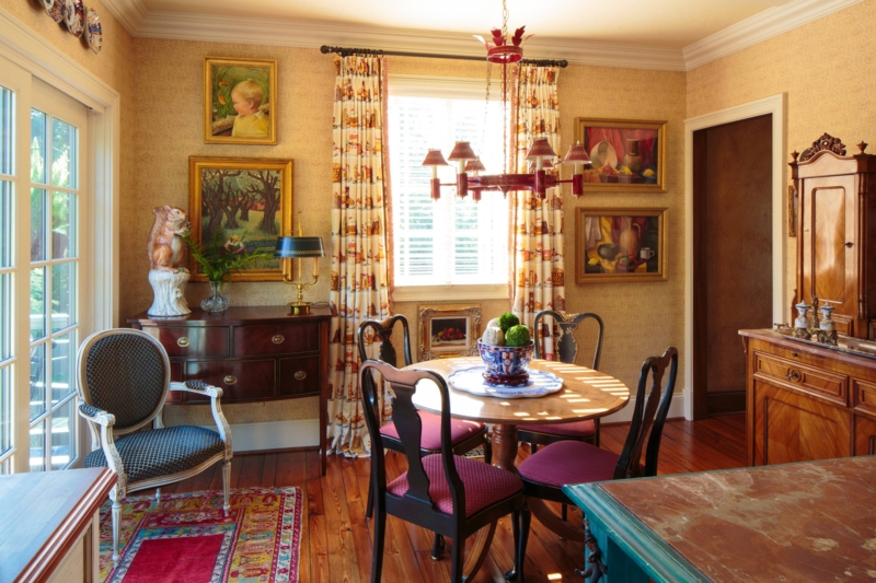 Traditional Dining Room with antiques and a striking red chandelier.