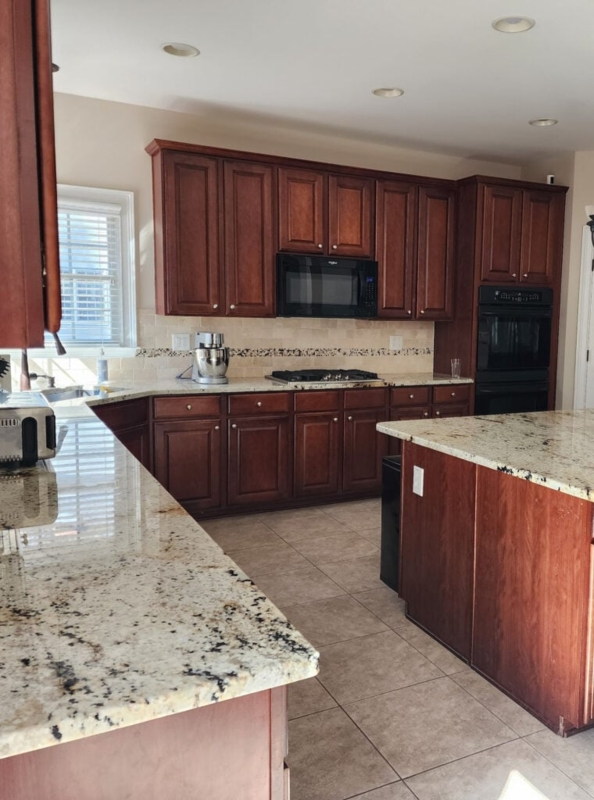 Traditional Kitchen with Cherry Wood Cabinets and Speckled Granite