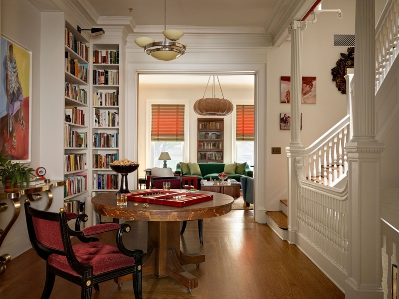 Traditional Library Room Layout Ideas With Red Accent Chairs And Columns