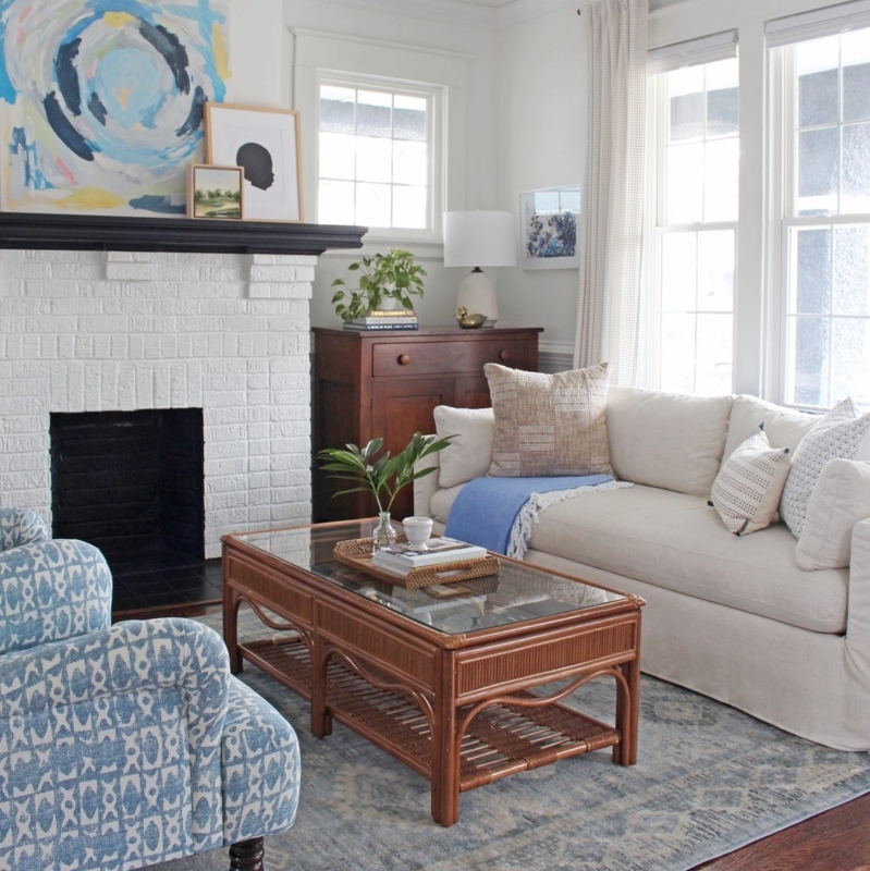 Traditional Living Room: White Brick Fireplace & Woven Table