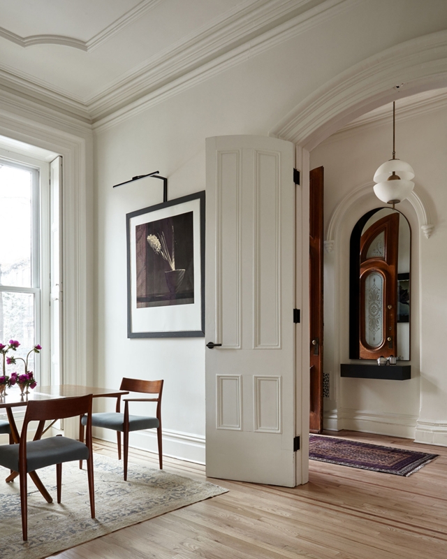 Transitional Dining Room Architectural Details with Arched Doorway