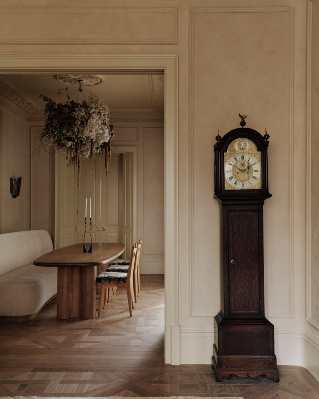 Transitional Grandfather Clock in Dining Room with Floral Chandelier