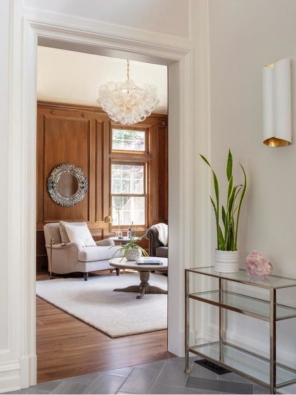 Transitional Hallway with Wood Paneling & Glass Bubble Chandelier