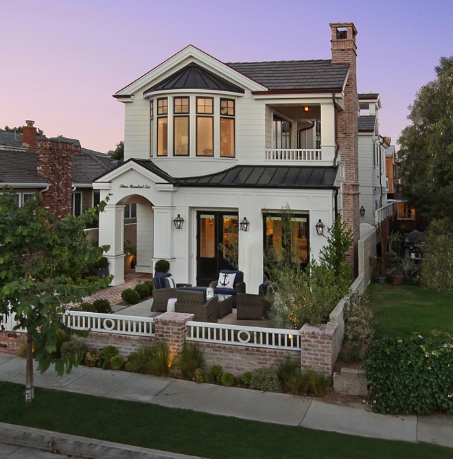 Transitional Home Exterior: White Siding & Black Window Frames
