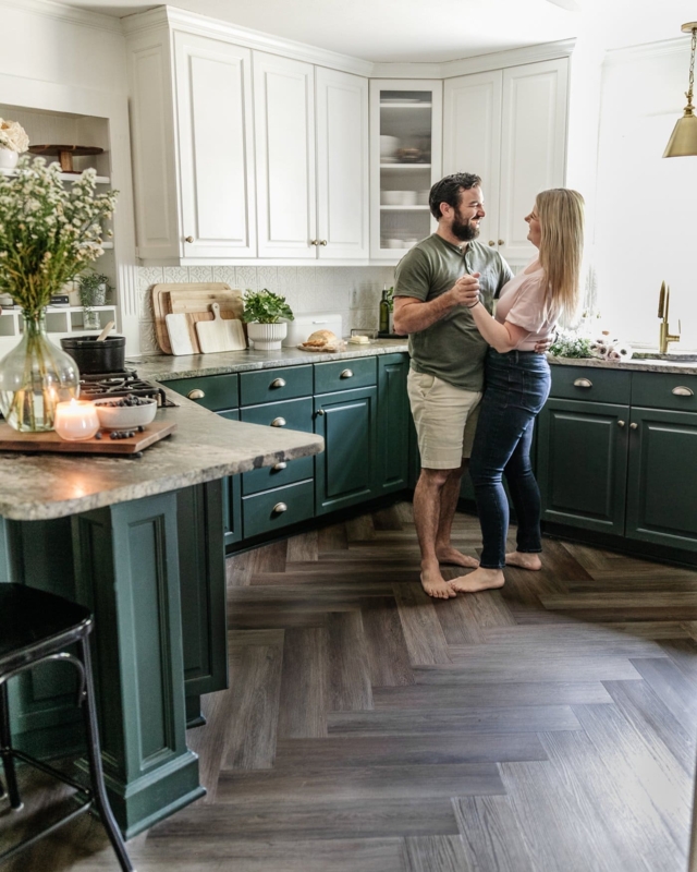 Transitional Kitchen: Dark Green Cabinets & Herringbone Wood Floor