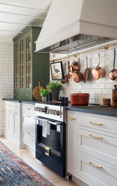 Transitional Kitchen with Olive Green Cabinetry and Brass Pot Rail