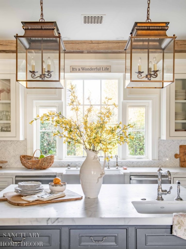 Transitional Kitchen with Oversized Lanterns & Marble Island