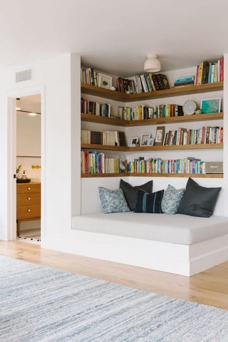 Transitional Recessed Nook with wrap-around shelving and daybed.